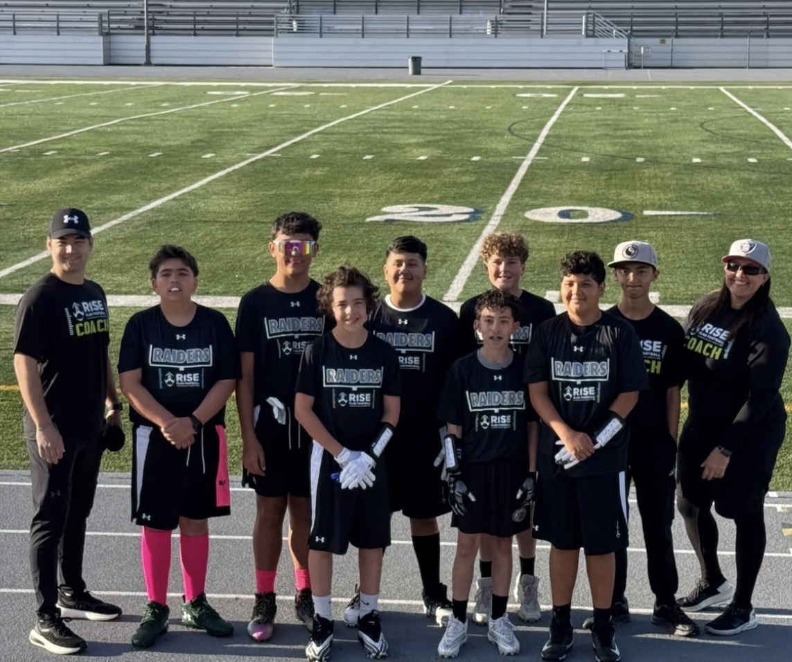 Raiders team photo at midfield